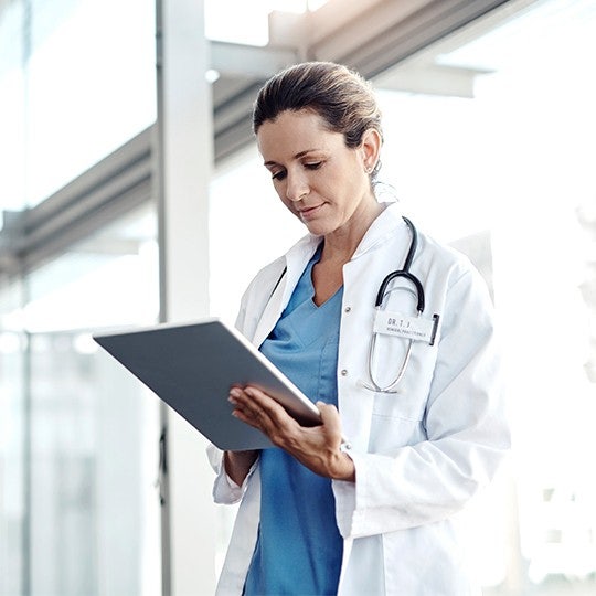 doctor with tablet