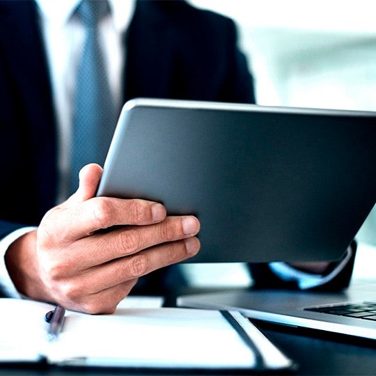 hands holding a tablet