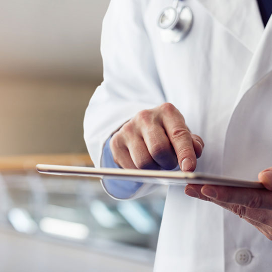 doctor holding a tablet