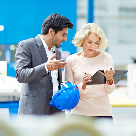 colleagues doing a factory check