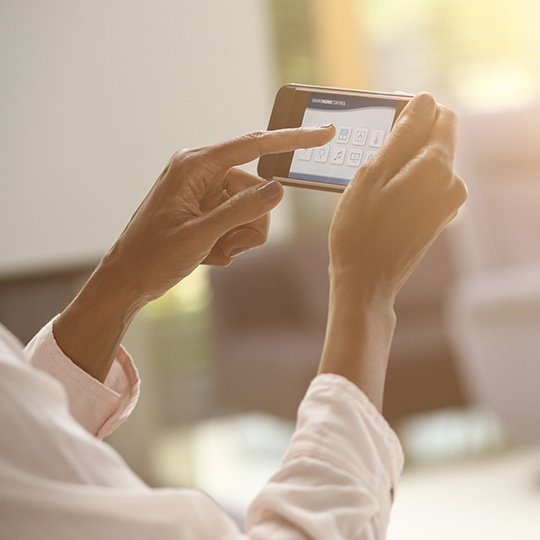 close up of hand holding a smartphone