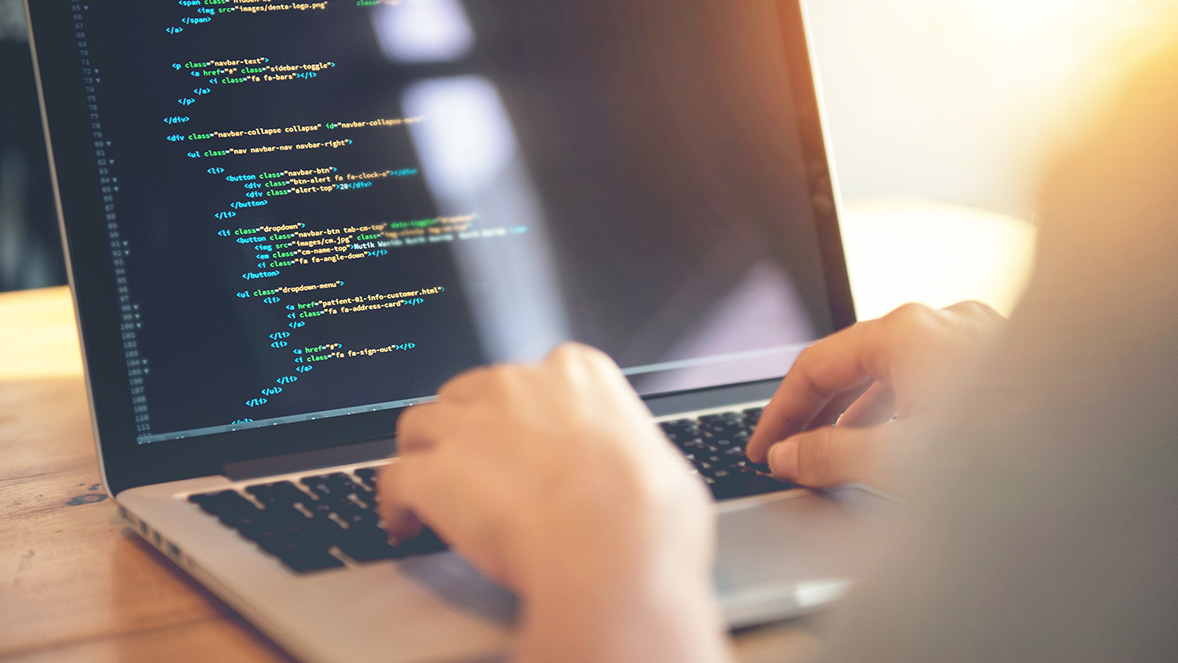 close up of a laptop screen showing coding