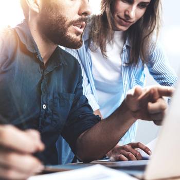 Printing in a Paperless World man pointing at laptop screen