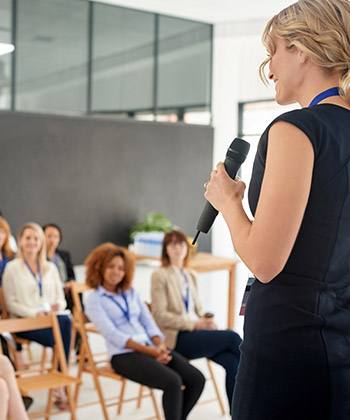 woman presenting in front of a group