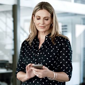 Discover 5G's impact on the cloud woman texting in her phone
